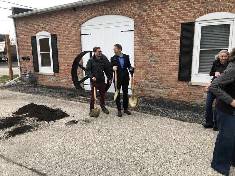 Jack Victor, of Northpointe, and Richard Koenig of  the Housing Opportunity Development Corporation, invite dignitaries to turn a shovel of dirt before the rain set in Monday during the groundbreaking for the Taylor Place Apartments in McHenry.