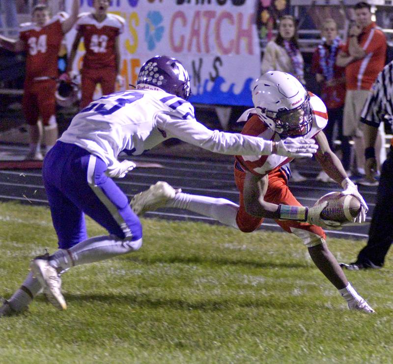 Streator’s Isaiah Brown tries to get into the end zone as Manteno's Tyson Clodi tries to stop him on a first-quarter run Friday, Sept. 15, 2023, at Doug Dieken Stadium.