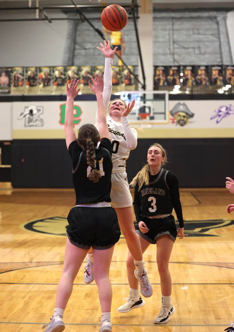 Sycamore's Lexi Carlsen shoots between Kaneland's Kyra Lilly (left) and Alexis Schueler during their Class 3A sectional semifinal Tuesday, Feb. 20, 2024, at Sycamore High School.