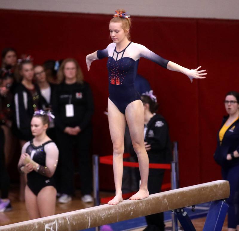 Oswego co-op’s Sam Phillip competes on the balance beam during the IHSA Girls State Gymnastics Meet at Palatine High School on Friday, Feb. 16, 2024.