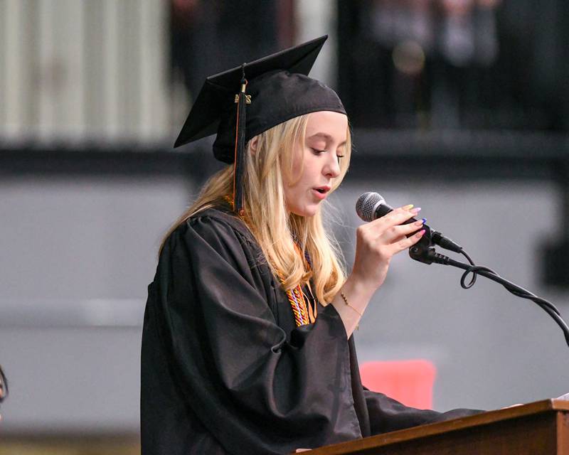 DeKalb High School graduate Grace Leopardo acknowledges District 428 staff and school board members during the 2024 DeKalb High School commencement ceremony on Saturday, May 25, 2024, at the Northern Illinois University Convocation Center in DeKalb.