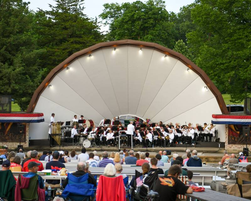 The DeKalb Municipal Band performs its annual Independence Day concert at the Dee Palmer Band Shell in Hopkins Park in DeKalb on Monday July 4, 2022 to celebrate the Fourth of July.