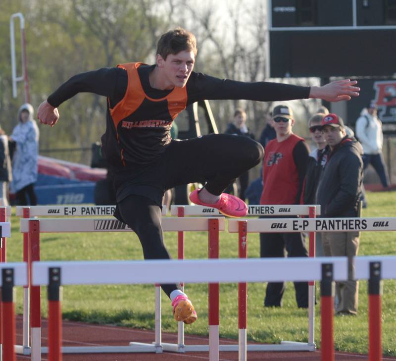 Milledgeville's Parker Krogman clears a hurdle as he heads to the finish line in first place in the 100 hurdles at the Ed Schmidt Invitational Track Meet at Erie High School on Friday, April 19, 2024.