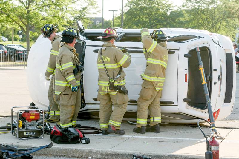 Elburn Firefighters demonstrate extricating a victim from a serious auto accident during the Campton Hills National Night Out event on Tuesday, August 2, 2022.