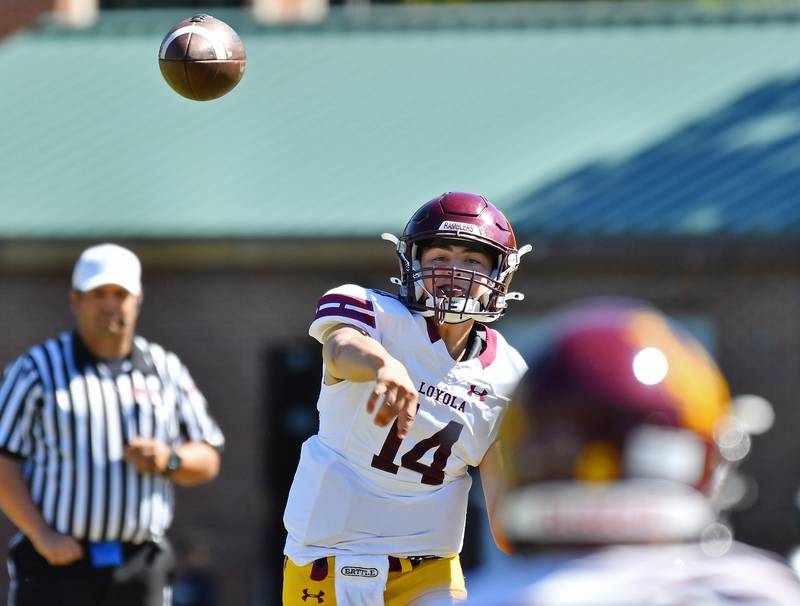 Loyola quarterback Dom Maloney (14) passes to an open receiver during a game on September 7, 2024 at Glenbard West High School in Glen Ellyn.