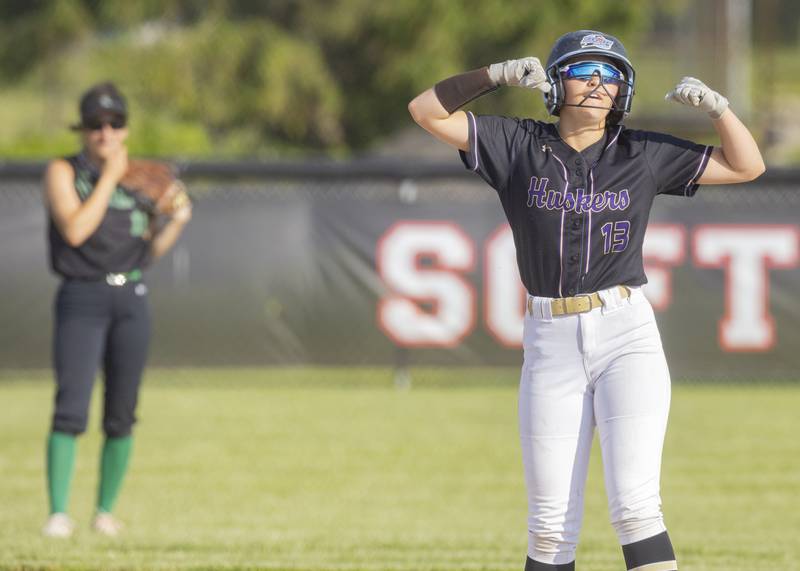 Serena's Brynley Glade (13) flexes toward her team's dugout in celebration of her RBI double against Dwight during the Class 1A sectional semifinal May 21, 2024, at Woodland School in rural Streator.