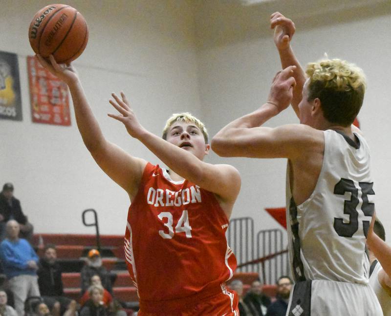 Oregon's Cade Girton shoots against River Ridge in the third place game at the 62nd Forreston Holiday Tournament on Thursday, Dec. 21, 2023.