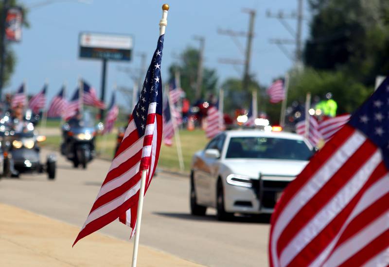 A  motorcade approaches as McHenry Community High School hosted a celebration Sunday for veterans returning from an Honor Flight trip to Washington D.C. The Honor Flight trip was coordinated by the Veterans Network Committee of Northern Illinois.