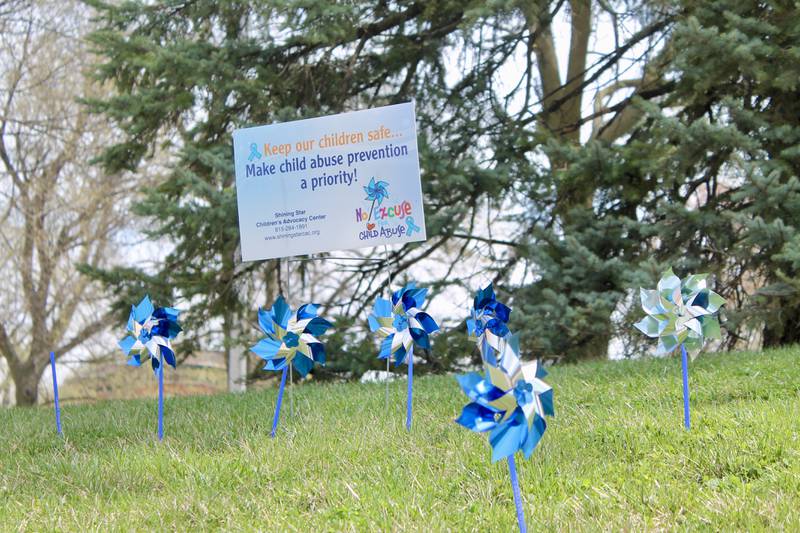 Blue and silver pinwheels adorn the grounds of the Old Lee County Courthouse in Dixon on Friday, April 14, 2023 in observance of April as National Child Abuse Prevention Month.