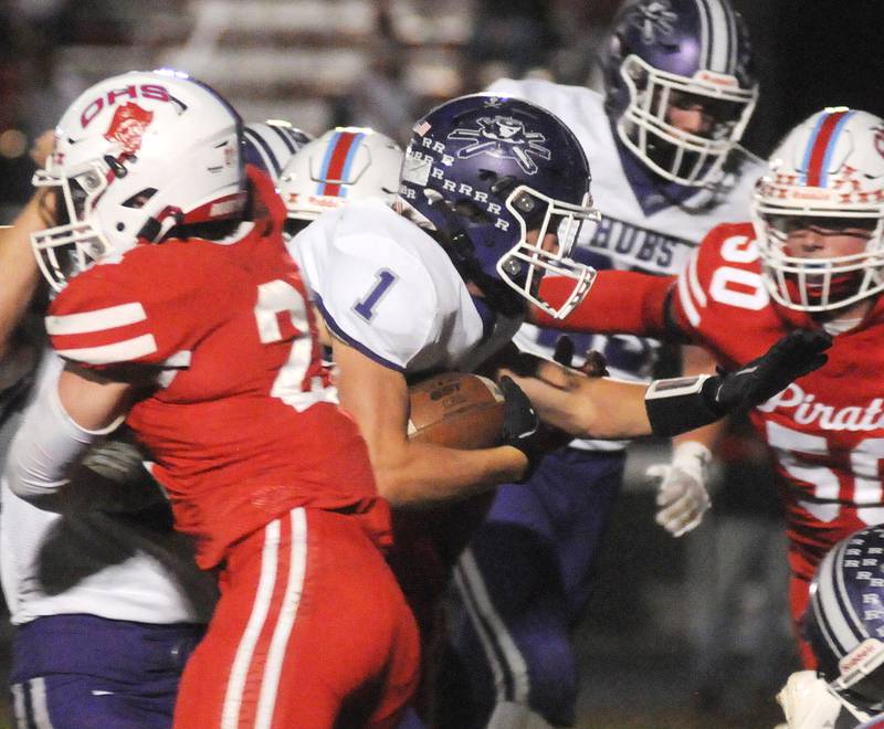 Ottawa's Jace Veith and Cooper Smith (50) try to stop Rochelle's Grant Gensler at King Field on Friday, Oct. 18, 2024.