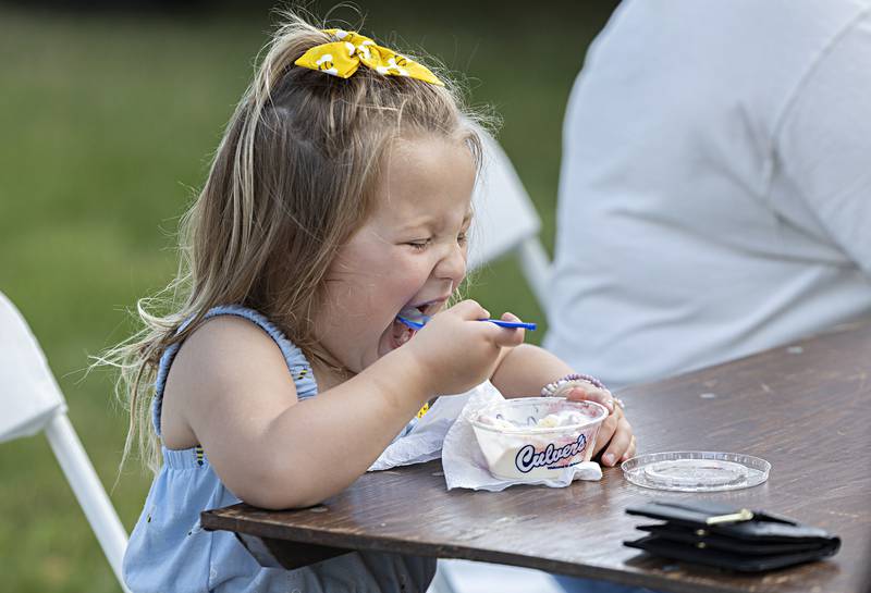 Oaklyn Eich, 3, digs into a cup of Culver’s custard Friday, June 30, 2023. The annual Family Fun Night near the old Lee County Courthouse kicked off Petunia Fest with an ice cream social, games for the kids, a touch-a-truck and music by the Dixon Municipal Band.