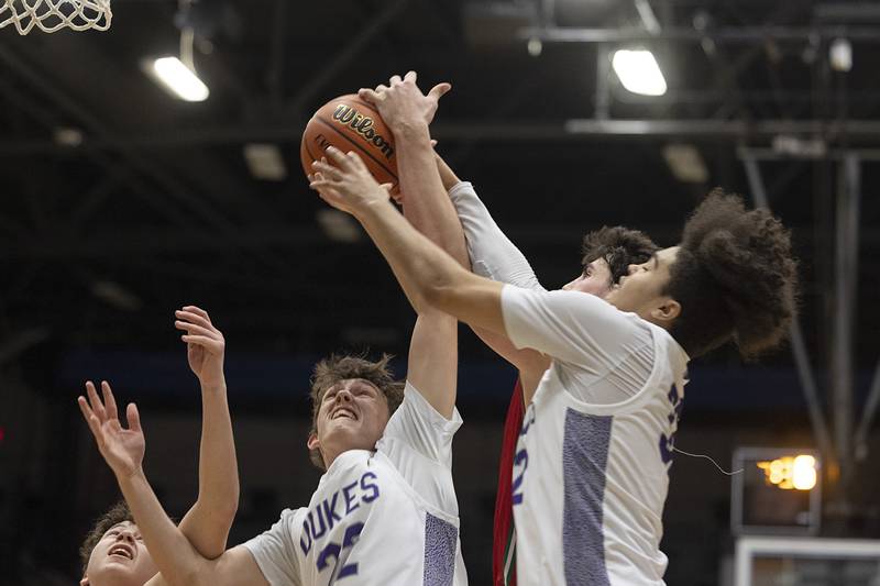 Dixon’s Bryce Feit fights for a rebound against LaSalle-Peru Wednesday, Feb. 21, 2024 at the Sterling class 3A basketball regional.