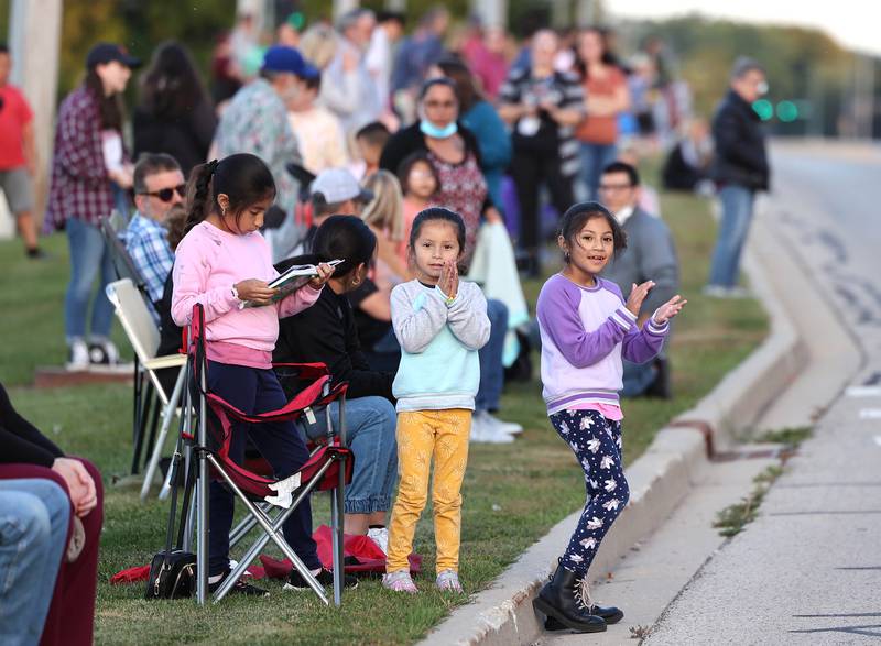 Parade attendees line Dresser Road in front of DeKalb High School Wednesday, Oct. 5, 2022, to watch the school's homecoming parade.