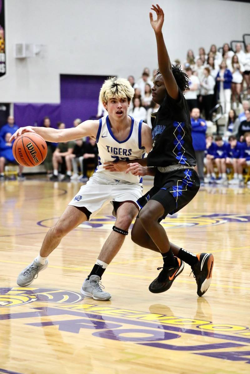 Princeton's Noah LaPorte drives against Rockford Christian in Tuesday's Class 2A regional semifinal at Mendota. The TIgers won 69-66 to advance to Friday's championship game.