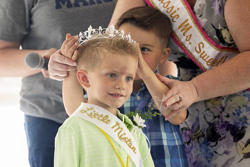 Greysen Collins, 6, is crowned Little Mister by last year’s winner, Max Rosquist, Thursday, June 13, 2024, during Polo’s Town and Country Days.