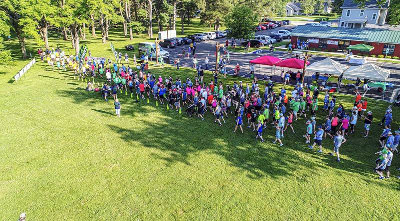 Runners take off from the starting line of the NAMI Sauk Area 5K in 2019.