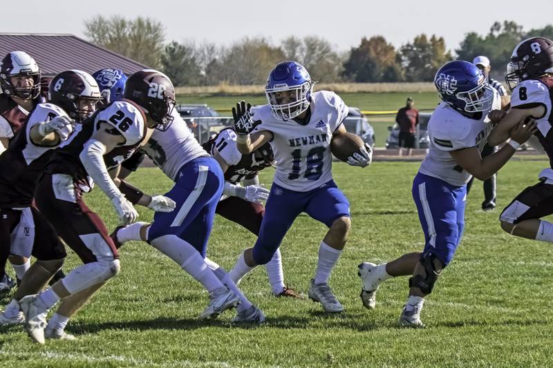 Newman’s Brady Grennan looks for running room Saturday, Oct. 29, 2022 during the Comet’s first round playoff game against Rockridge.