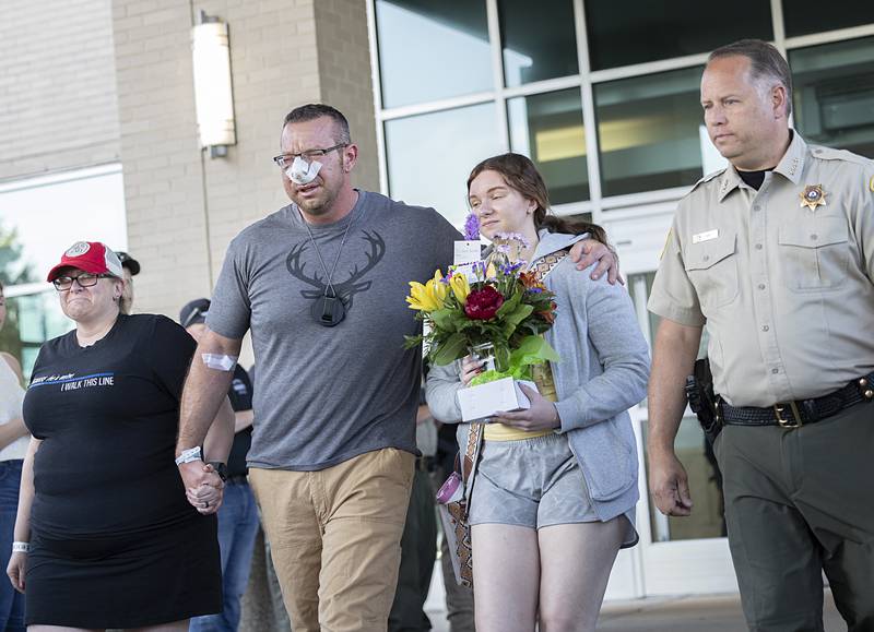 Lt. Jason Ketter is saluted as he leaves OSF Medical Center in Rockford on Friday, June 14, 2024. Ketter walked out with family and Ogle County Sheriff Brian VanVickle. Ketter was shot in the line of duty in Lost Nation, near Dixon, on Wednesday, June 12.