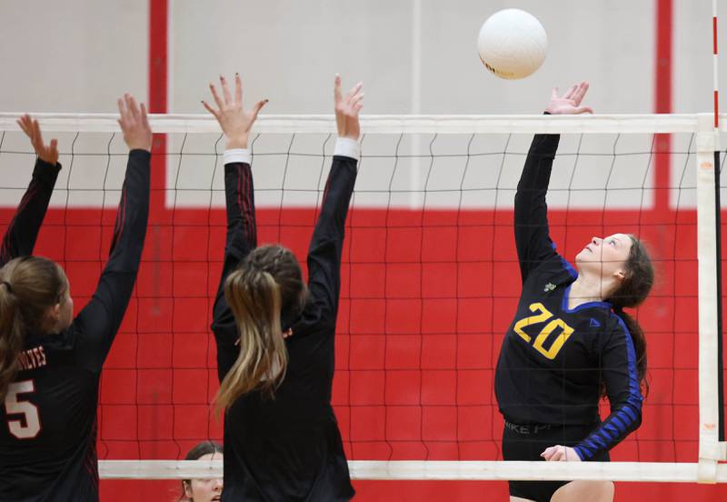 Somonauk's Amelia Grace tries to spike the ball past an Indian Creek blocker during their regional first round match Tuesday, Oct. 25, 2022, at Aurora Christian High School in Aurora.