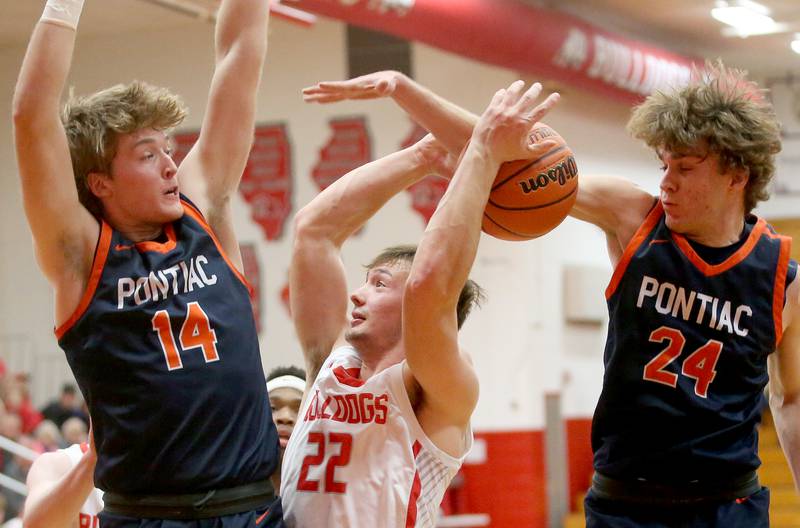 Streator's Christian Benning his his shot blocked by Pontiac's Kerr Bauman as teammate Henry Brummel defends during the Class 3A Regional semifinal game on Wednesday, Feb. 22, 2024 at Pops Dale Gymnasium.