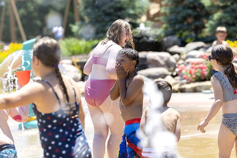 Kendry Donley, 7, of Dixon reacts to a deluge of water Wednesday, June 12, 2024 at the Dixon Park District splash pad.