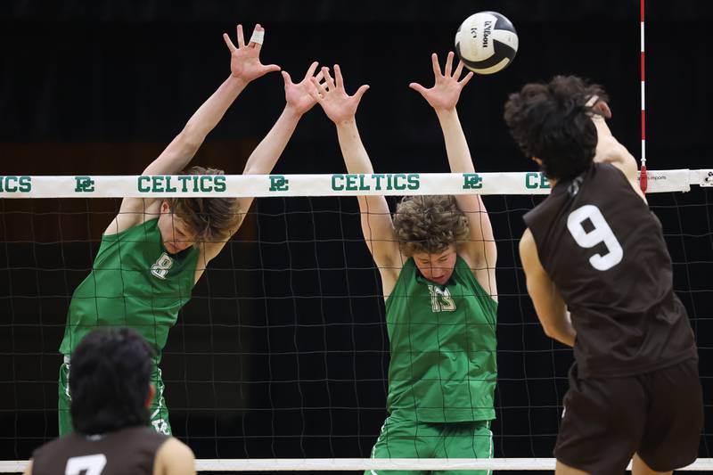 Providence’s Hayden Hill, left, and Sean Dovin go for the block against Joliet Catholic on Monday, March 25, 2024 in New Lenox.