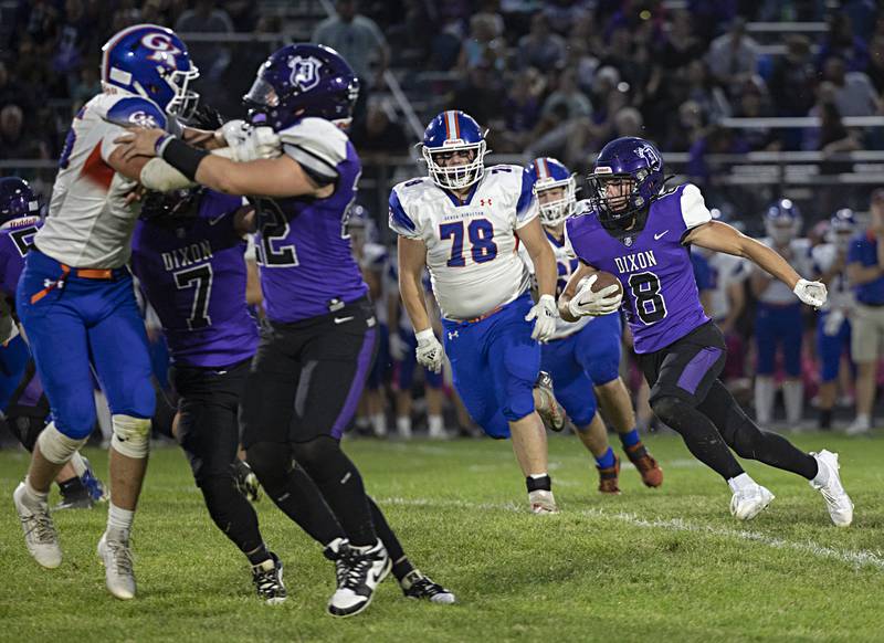 Dixon’s Tyson Dambman hits the hole Thursday, Sept. 14, 2023 against Genoa-Kingston in a game at Dixon High School.