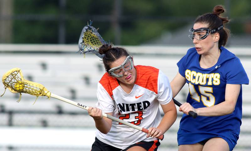 Crystal Lake Central’s Colleen Dunlea, left, moves past  Lake Forest’s Brooke Bolton during girls lacrosse supersectional action at Metcalf Field on the campus of Crystal Lake Central Tuesday.