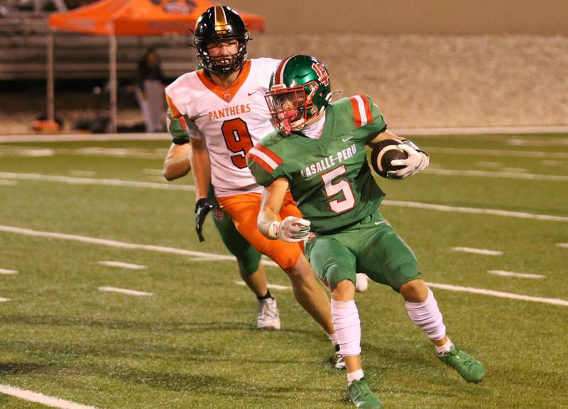 L-P's Brevyn Vogel looks to run up the field as he is chased down by United Township's Rowan Kallal on Friday, Aug. 30, 2024 at Howard Fellows Stadium.