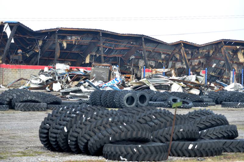 Tires lay in the parking lot surrounding the old Moore Tires' Rock Falls location on Tuesday, Feb. 6, 2024. The shop, located at at 2411 E. Rock Falls Road/U.S. Route 30, was destroyed by a fire on Jan. 16. Rock Falls firefighters were called about 4:25 a.m. to the 70,000-square-foot facility.