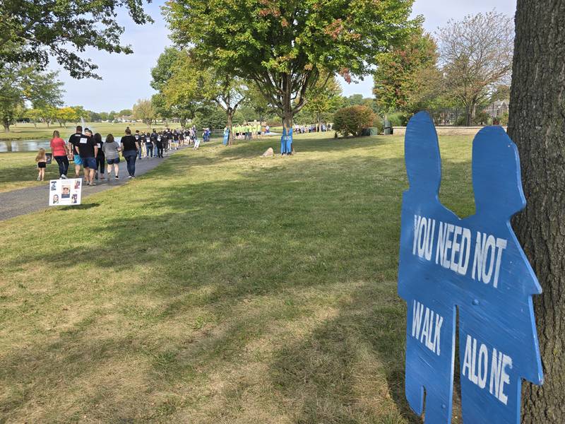 Walkers participate Sunday, Sept. 15, 2024, at the Compassionate Friends Walk to Remember at Baker Lake in Peru.