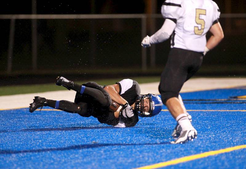 Geneva’s Justin Taormina makes a catch in the end zone for a touchdown during the Vikings’ 22-19 win Friday over Richards in Geneva.