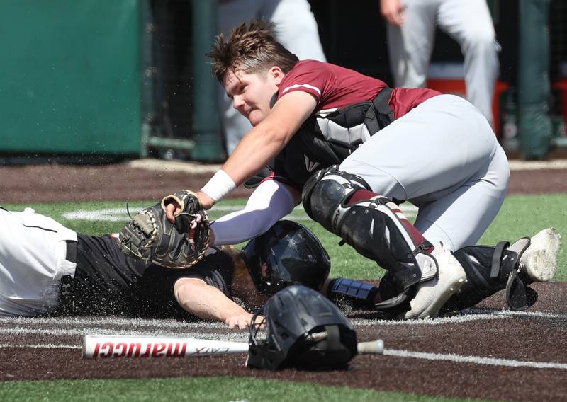 Morris' Griffin Zweeres tags out Crystal Lake Central's Connor Gibour trying to score during their Class 3A state semifinal game Friday, June 7, 2024, at Duly Health and Care Field in Joliet.