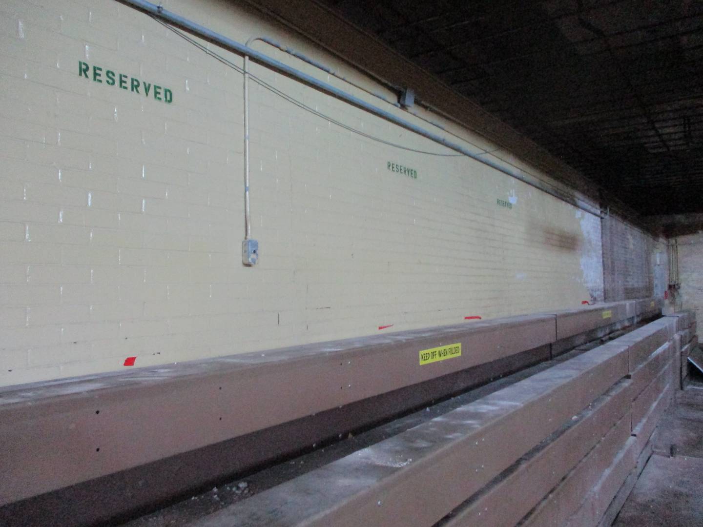 Folded bleachers line one wall of the old Joliet Catholic High School gym, which will be demolished. Aug. 28, 2024