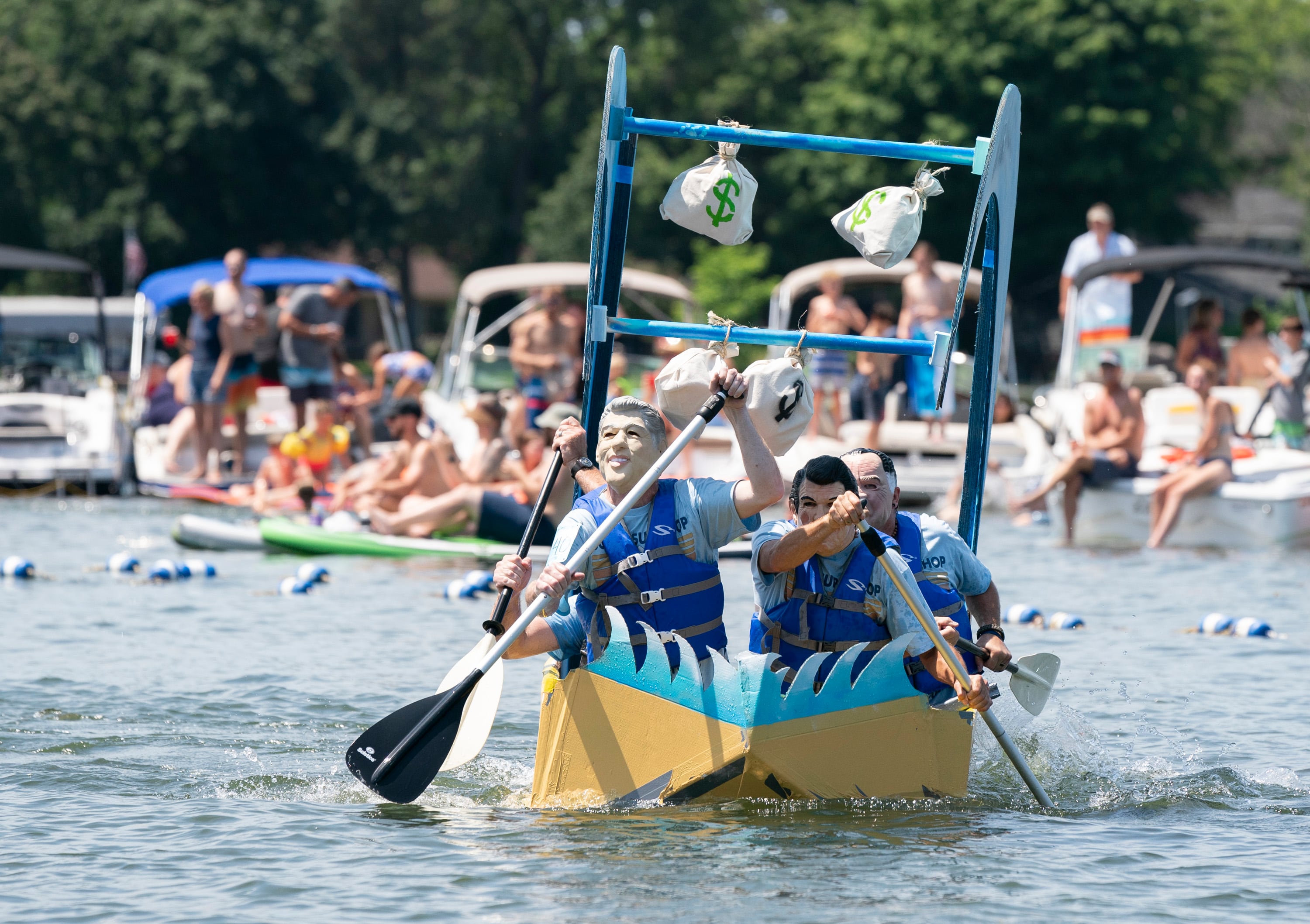 The cardboard boat Point Break, piloted by Fred Vroman, of Marengo, Eric Huebsch, of Los Angeles, Tony Duffy, and Tim Cunnally, both of Crystal Lake, during the Crystal Lake Cardboard Regatta on Saturday, July 23, 2022 at Main Beach in Crystal Lake. Cardboard took to the lake as a fundraiser for the Crystal Lake Parks Initiative Foundation. Ryan Rayburn for Shaw Local