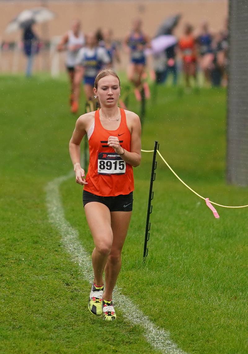 Wheaton Warrenville South’s Nicole Poglitsch (8915) leads the pack in the first leg of the girls Dukane Conference Cross Country Championships at Lake Park High School in Roselle on Saturday, Oct. 14, 2023.