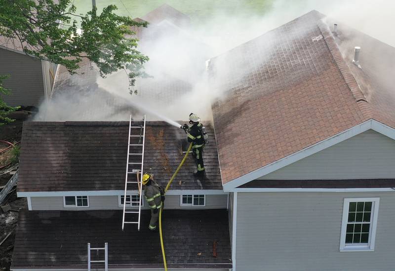 Tonica, and Leonore firefighters spray water on a structure fire in the 1900 block of East 8th Road on Wednesday, May 8, 2024 near Tonica. The fire happened just before 3:30p.m.