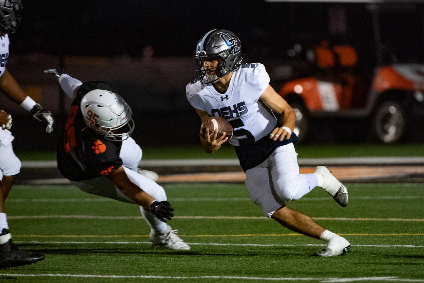 Oswego East's Niko Villacci runs the ball during a game against Plainfield East on Thursday Sept. 12, 2024 at Plainfield East High School