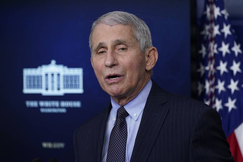 In this Jan. 21, 2021, photo, Dr. Anthony Fauci, director of the National Institute of Allergy and Infectious Diseases, speaks with reporters in the James Brady Press Briefing Room at the White House in Washington. President Joe Biden is dispatching the nation’s top scientists and public health experts to regularly brief the American public about the pandemic. Beginning Jan. 27, the experts will host briefings three times a week on the state of the outbreak and efforts to control it.  (AP Photo/Alex Brandon)