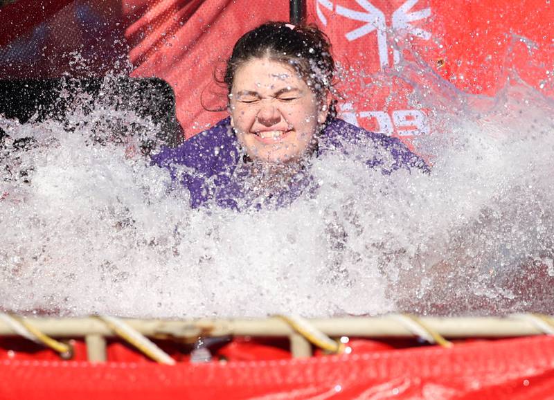 Members of the Sigma Lambda Sigma sorority jump into the water on a cold and windy Saturday, Feb 17, 2024, during the Huskie Stadium Polar Plunge at Northern Illinois University in DeKalb. The Polar Plunge is the signature fundraiser for Special Olympics Illinois.