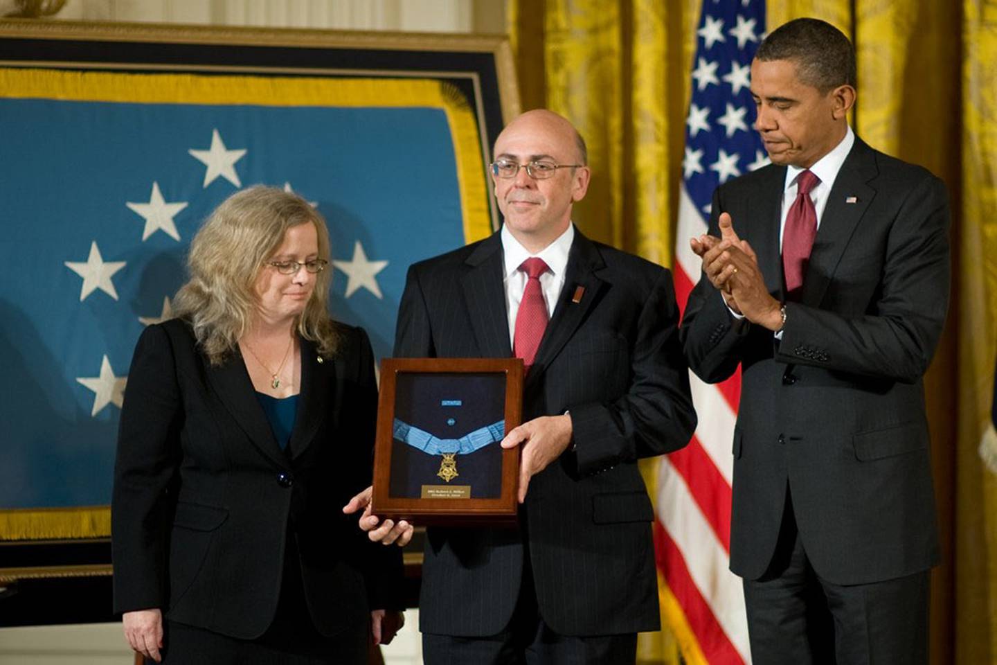 President Barack Obama presents the Medal of Honor to Phil and Maureen Miller, the parents of Army Staff Sgt. Robert J. Miller, during a White House ceremony, Oct. 6, 2010. Miller received the nation's highest honor for military valor for his actions in Afghanistan on Jan. 25, 2008, when he sacrificed his own life to save those of his teammates and 15 Afghanistan national army soldiers.