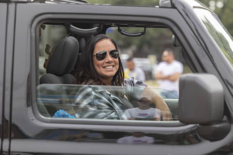 Joyce Piper smiles from her Jeep Saturday, Sept. 16, 2023 in the Sauk Valley Fiesta Days parade. Jeep enthusiasts had several of the popular vehicles in the parade.