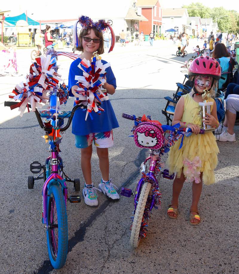 Shay Albrect-Frasch (left) won Most Patriotic, and Elara Giamalva (right) won Most Creative in the Maple Park Fun Fest Kids Bike Parade on Saturday, Sept. 2, 2023.