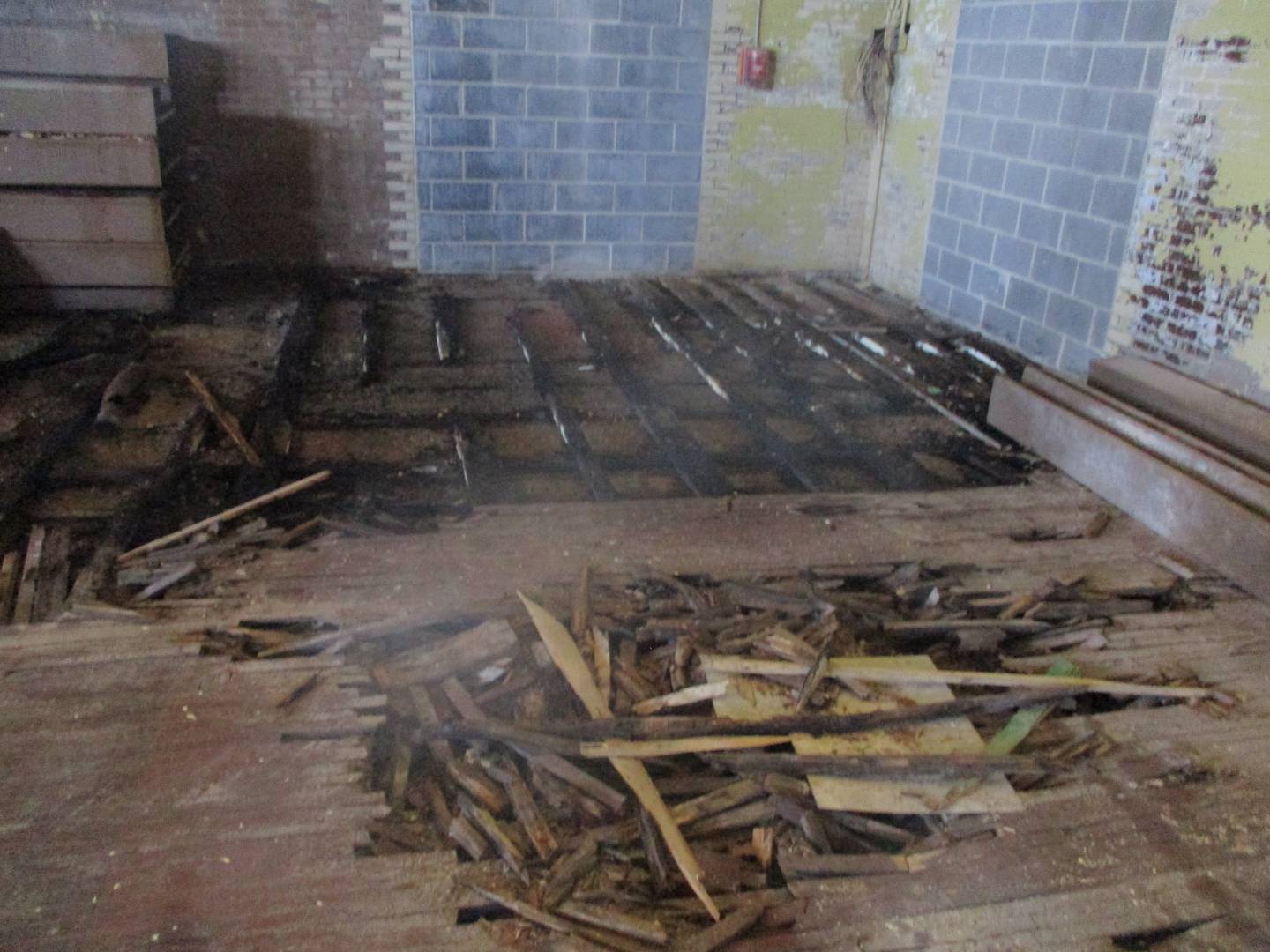 A rotted section of floor shows the deterioration at the old Joliet Catholic High School gym, which will be demolished. Aug. 28, 2024