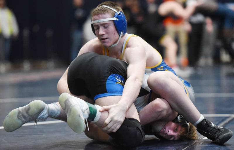 Wheaton North’s Thomas Fulton, top, wrestles Geneva’s Peyton Marzen in the 157-pound final during the Class 3A Conant wrestling sectional on Saturday, Feb. 10, 2024 in Hoffman Estates.