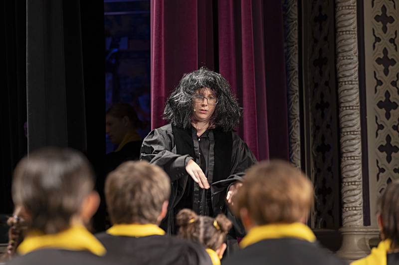 Micah Kutz rehearses with the cast of “Puffs” Wednesday, Nov. 1, 2023 at Dixon High School.