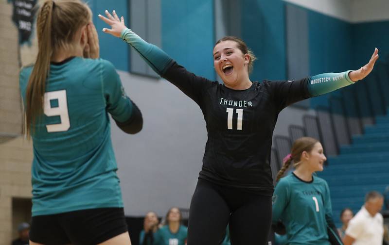 \Woodstock North's Maddie Sofie celebrates a point with Clara Klasek during a Kishwaukee River Conference volleyball match against Johnsburg on Wednesday, Sept. 4, 2024, at Woodstock North High School.