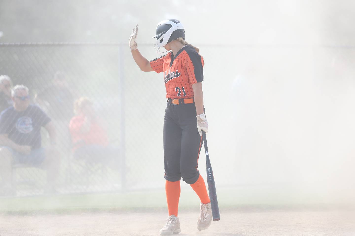 Minooka’s Sofia Dziuba calls time as a gust of wind creates a dust storm during the against Normal in the Class 4A sectional semifinal on Tuesday, May 21, 2024 in Minooka.