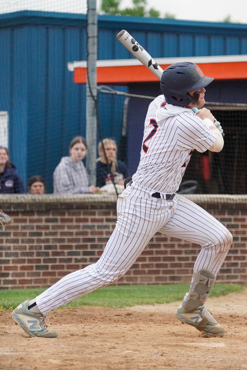 Oswego’s Easton Ruby (2) hits an RBI double against Oswego East during a baseball game at Oswego High School on Monday, May 13, 2024.