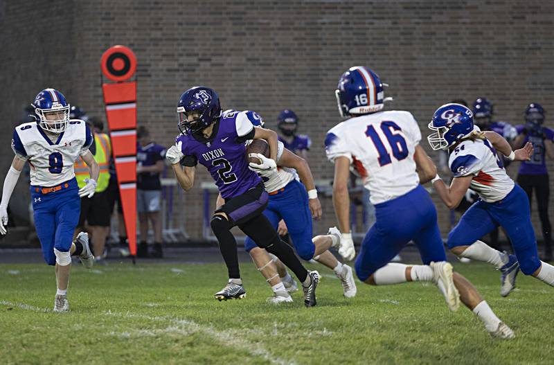 Dixon’s Cullen Shaner picks up yards after a catch Thursday, Sept. 14, 2023 against Genoa-Kingston in a game at Dixon High School.